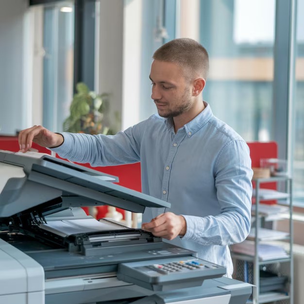 man-is-standing-front-printer-with-pen-it_981168-10153