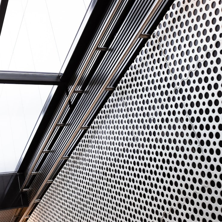 metal-lattice-wall-overhead-light-underpass_696657-37804