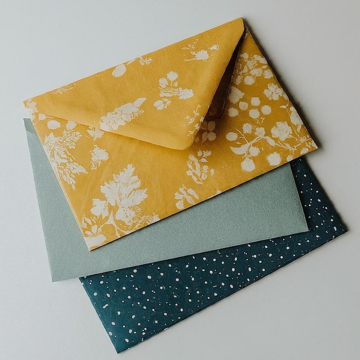 stack-envelopes-with-blue-white-pattern-side_1171594-39014