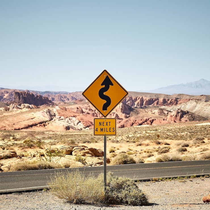sunny-scenery-yellow-traffic-signpost-valley-fire-state-park-nevada-usa_181624-43516